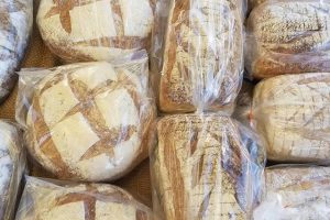 Fresh artisan loaves of bread at a farmer's market
